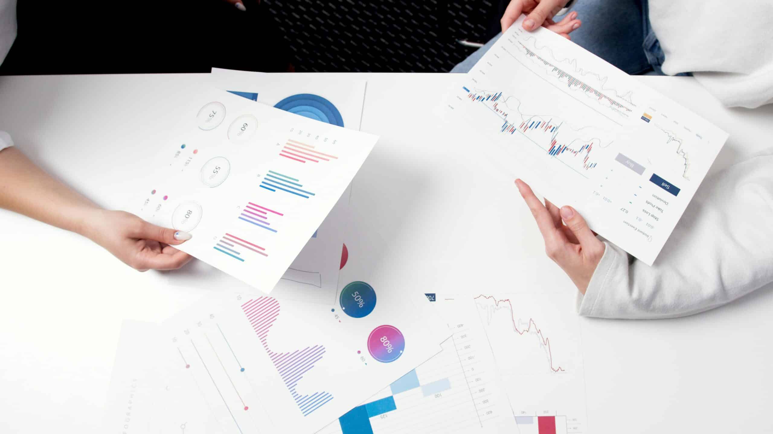 reviewing spreadsheets with financial charts